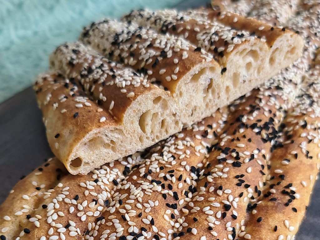 Barbari bread is a traditional Persian flatbread with an extra crispy crust from a special glaze as well as tasty sesame and nigella seeds. Try this version with the added flavors of sourdough fermentation and khorasan wheat or turkey red whole grain flours.